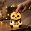 Child playing with cute panda silicone night light